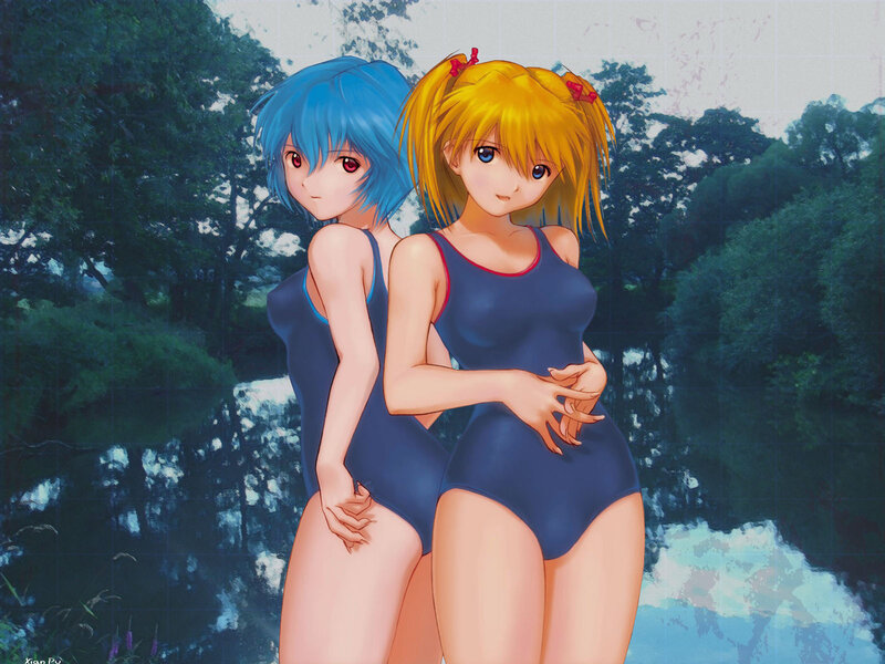 Two girls in swimsuits by water