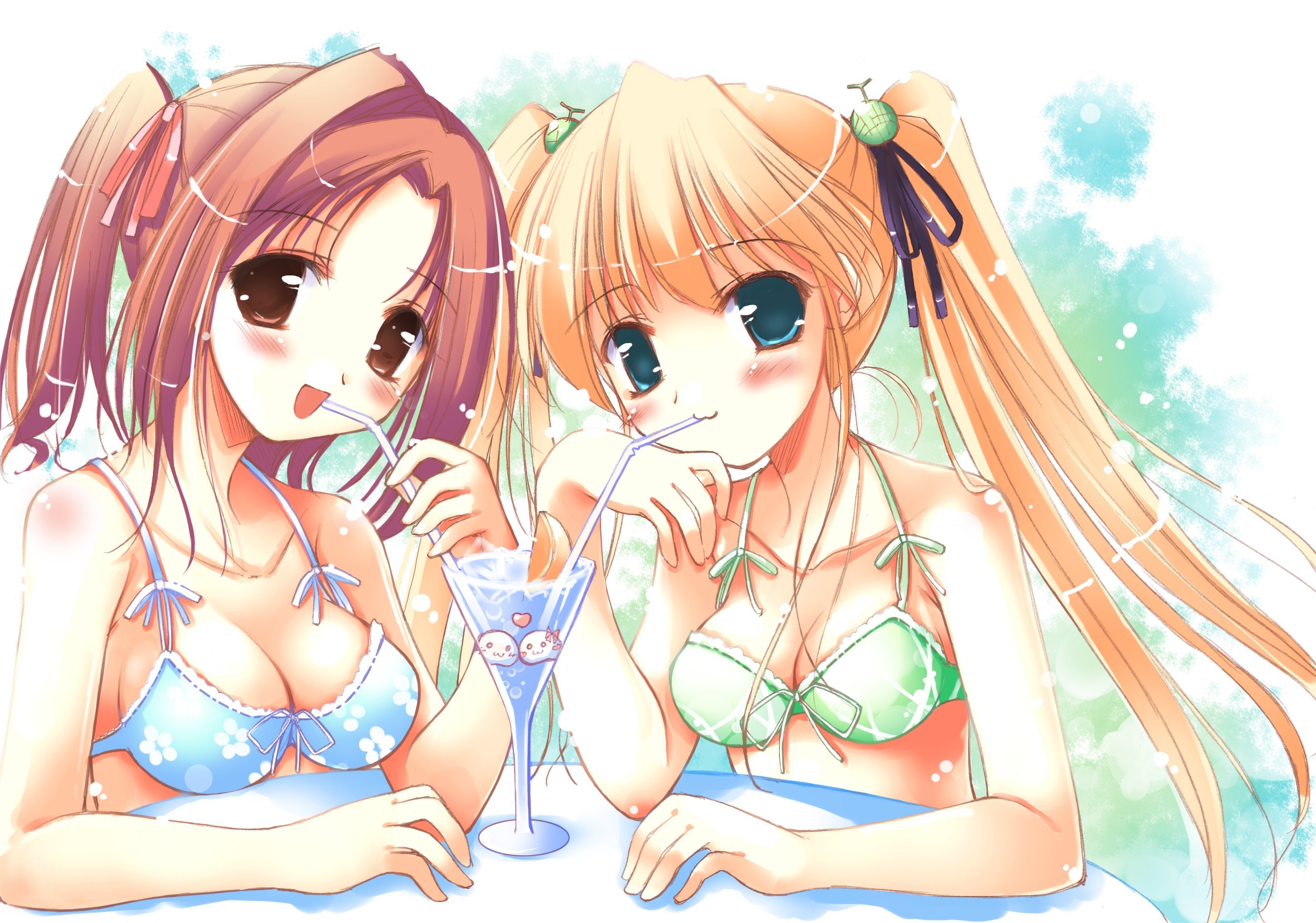 Two girls in swimsuits drinking