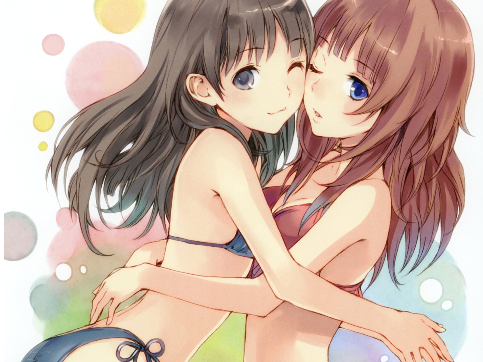 Two girls in swimsuits hugging