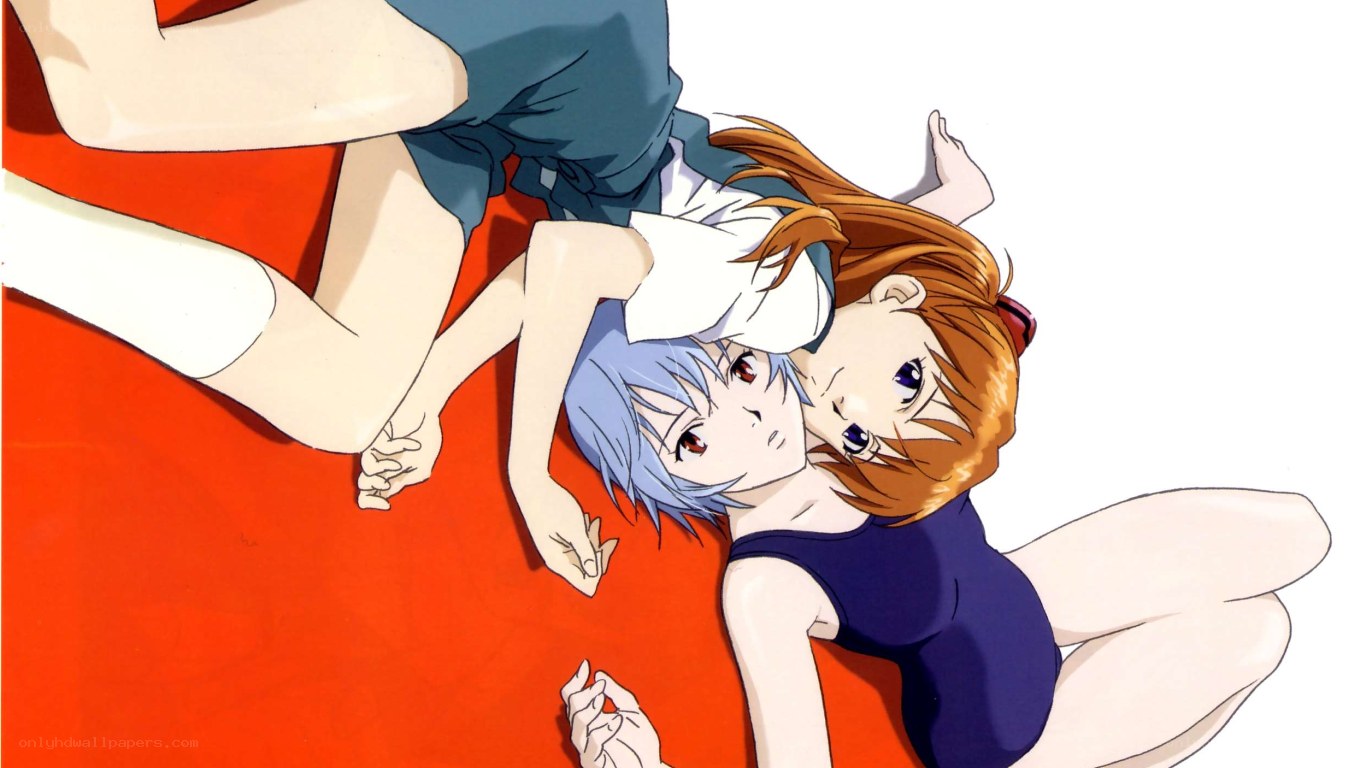 Two girls in swimsuits lying down