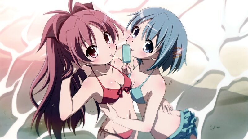 Two girls in swimsuits on beach