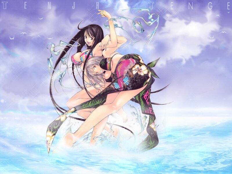 Two girls in swimsuits on beach