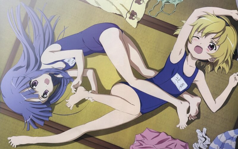 two girls in swimsuits on floor