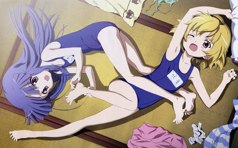 Two girls in swimsuits on floor