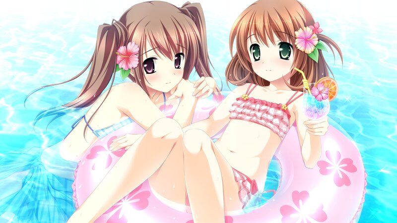 Two girls in swimsuits on pool floats