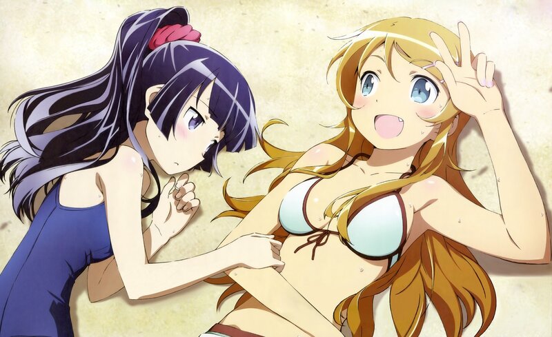 Two girls in swimsuits on the beach