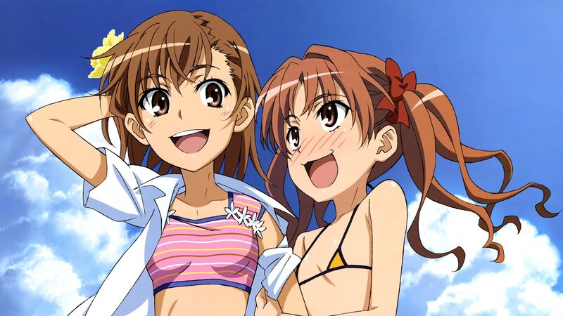 Two girls in swimsuits smiling