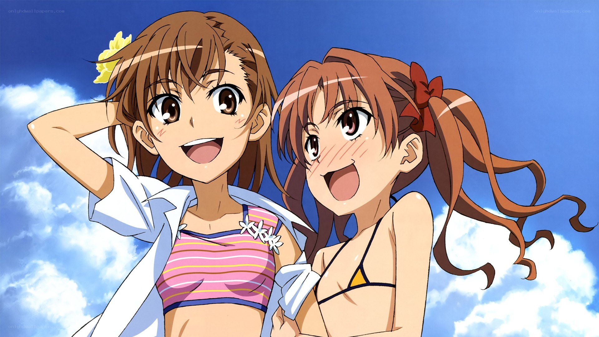 Two girls in swimsuits smiling