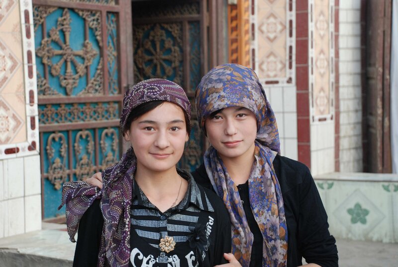 Two girls in traditional headscarves
