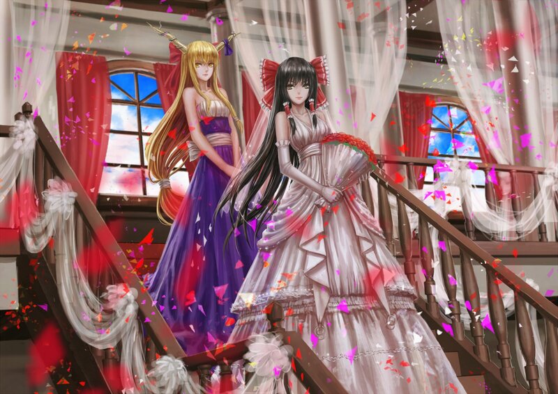 Two girls in wedding dresses on a staircase