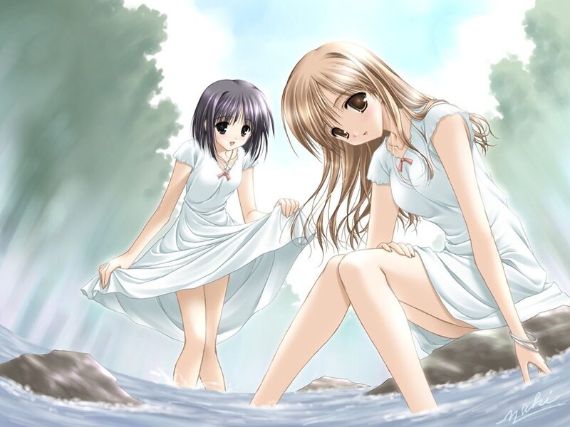 Two girls in white dresses by the water
