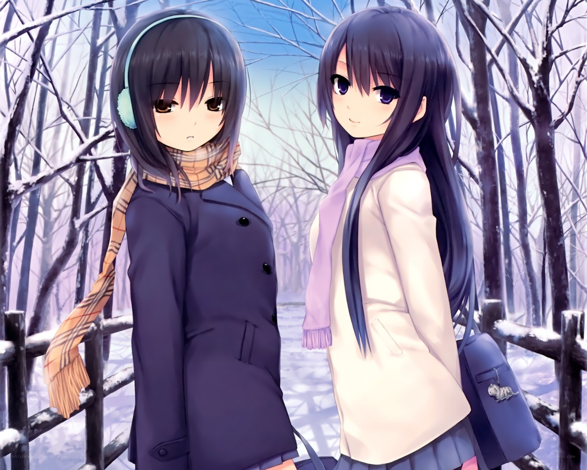 Two girls in winter forest