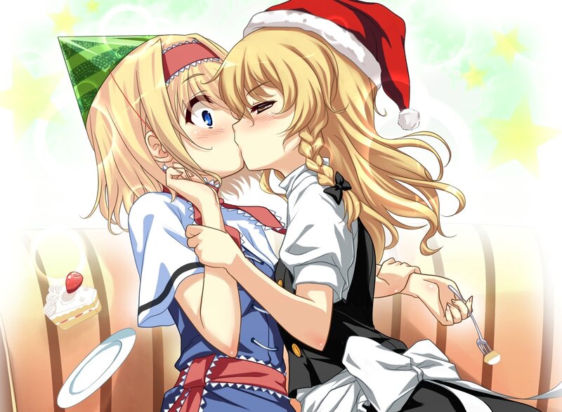 Two girls kissing at a party
