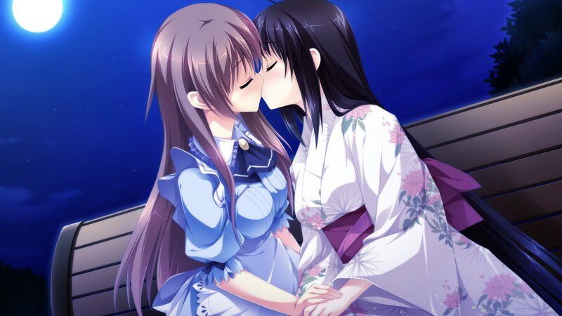 Two girls kissing at night