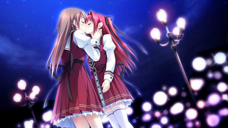 two girls kissing at night