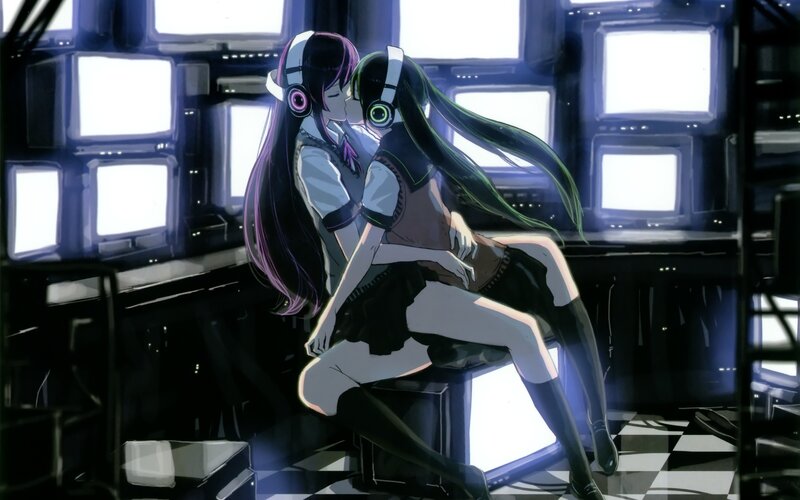 Two girls kissing in a control room