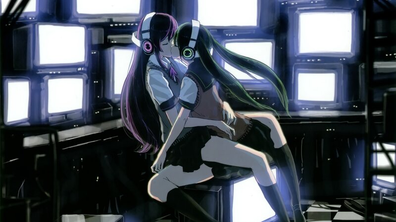 Two girls kissing in a control room