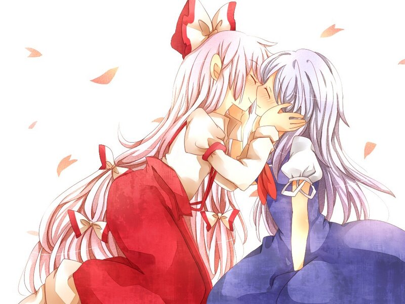 two girls kissing in autumn