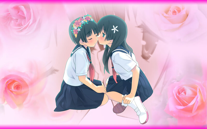 Two girls kissing in school uniforms