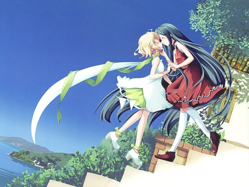 Two girls kissing on a cliff