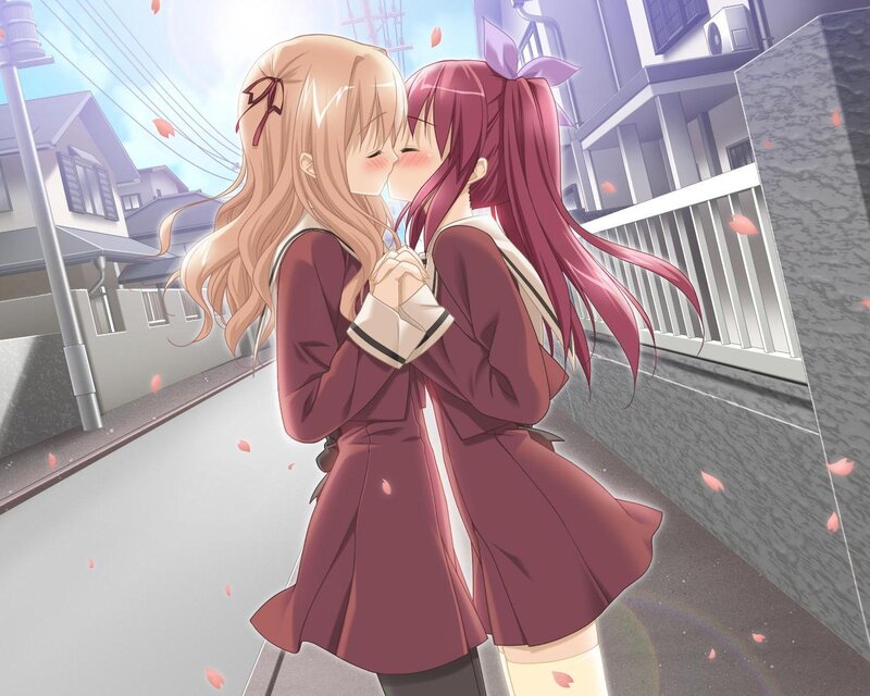 two girls kissing on street