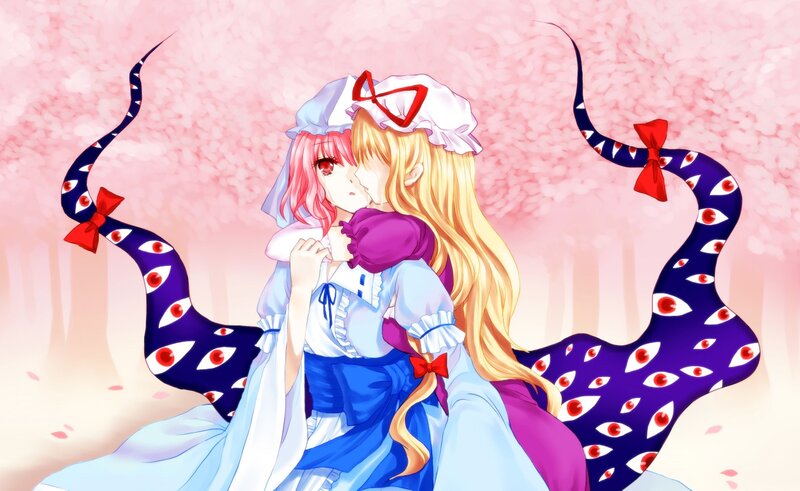 Two girls kissing under cherry blossoms