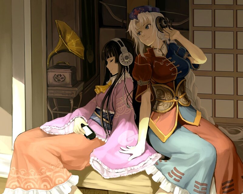 Two girls listening to music