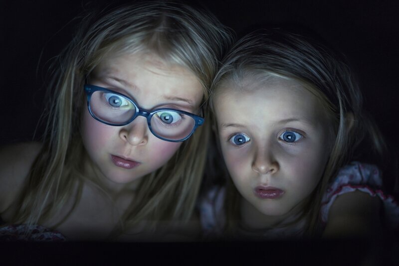 Two Girls Looking at Screen