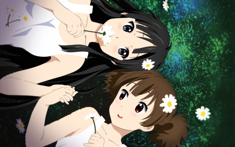 Two Girls Lying in Grass — Green, Serene, Afternoon