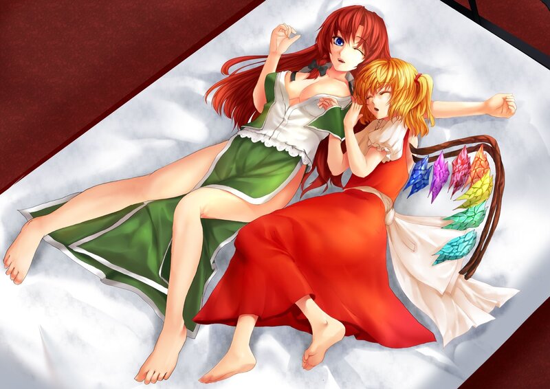Two girls lying on a bed