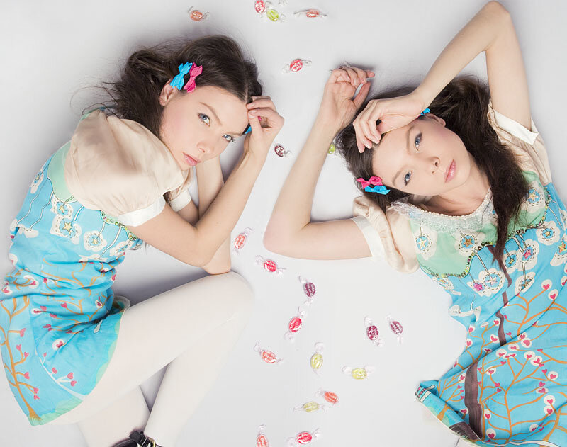 Two Girls Lying on Floor — Blue