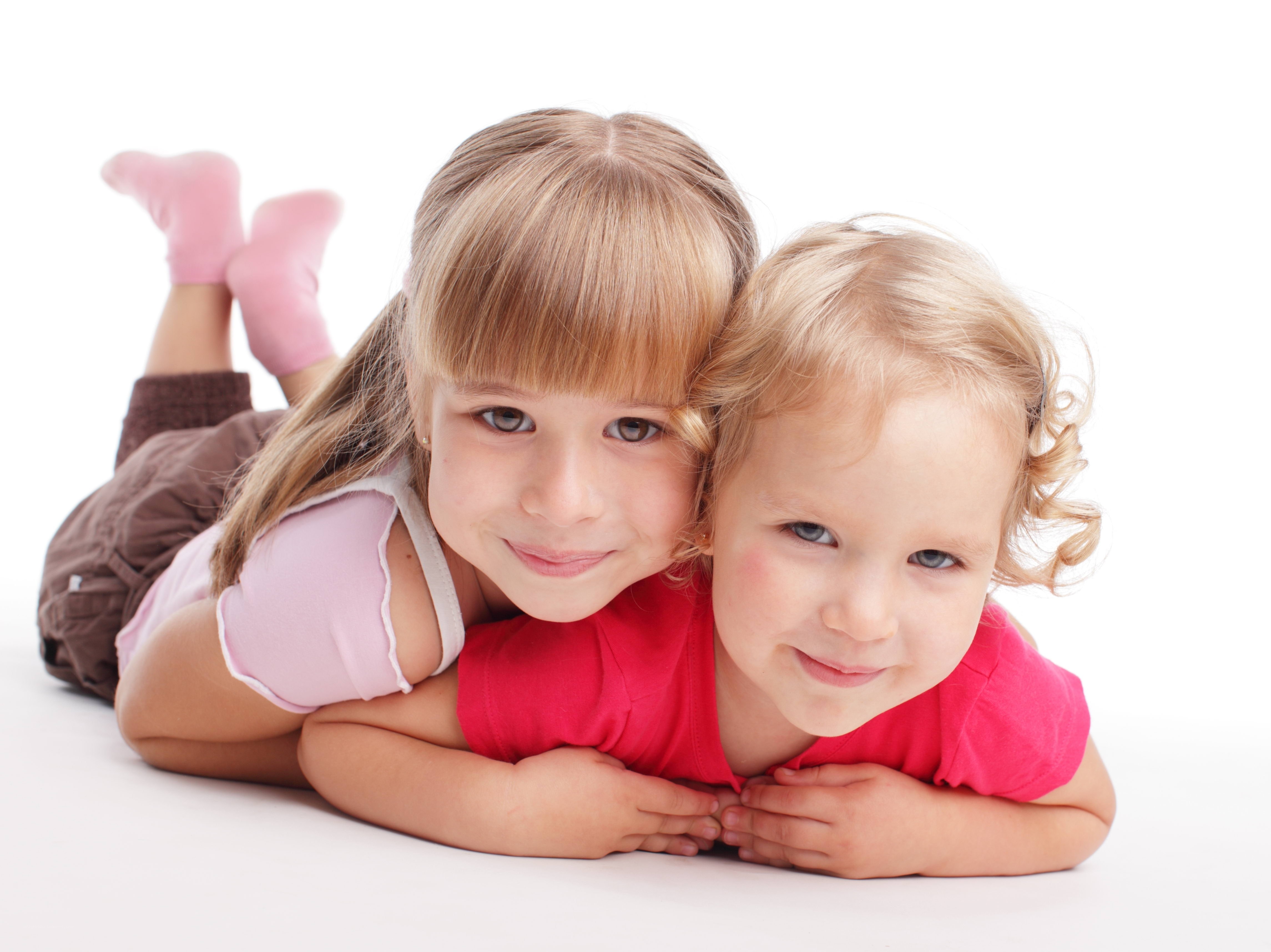 two girls lying on floor