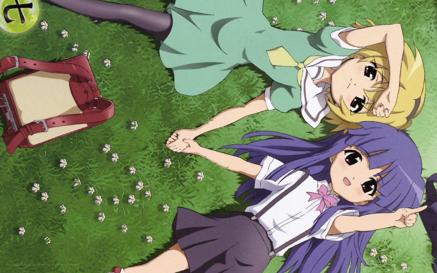 two girls lying on grass