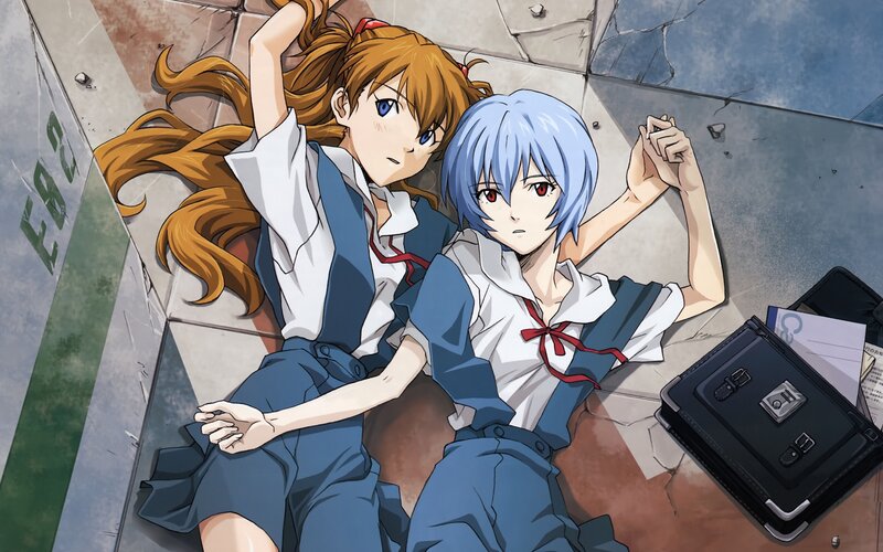 Two Girls Lying on Ground — Blue