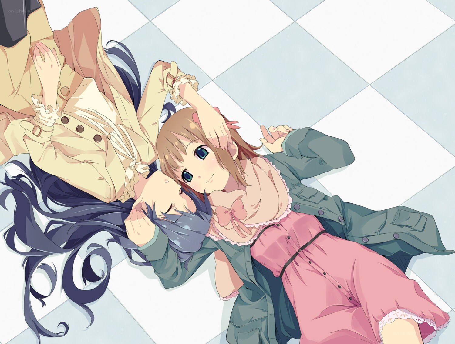 Two girls lying on the floor