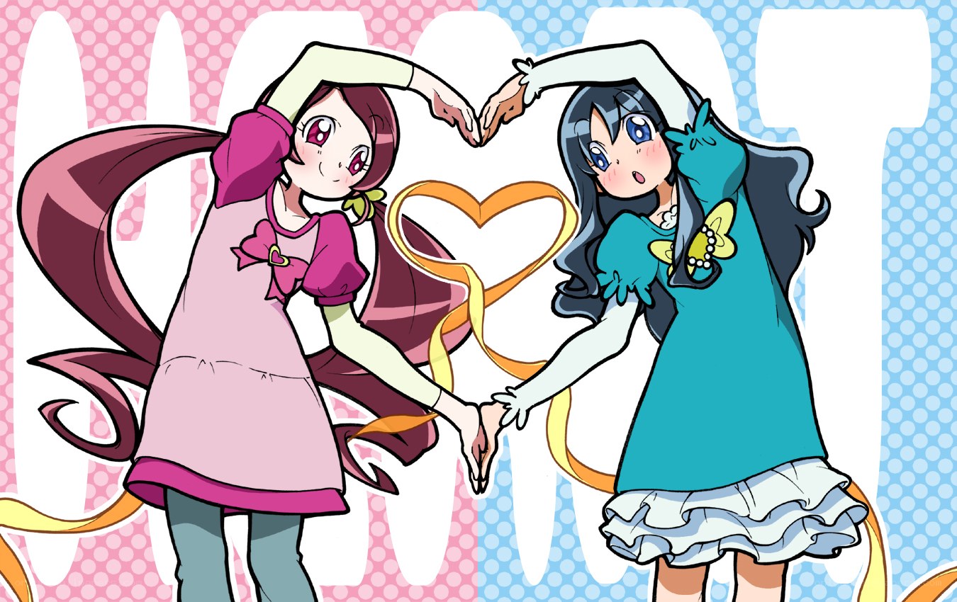 two girls making a heart shape