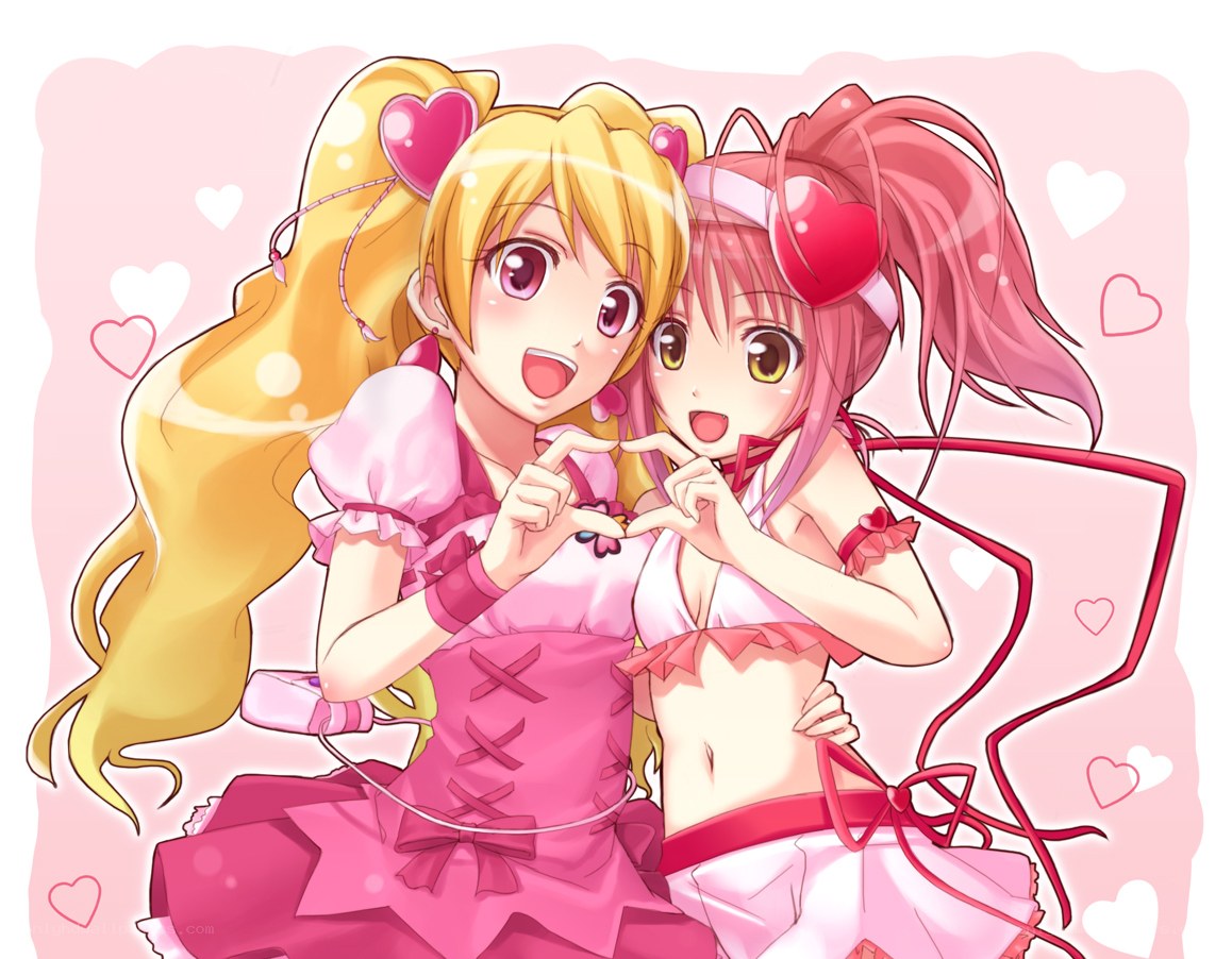 two girls making heart shapes