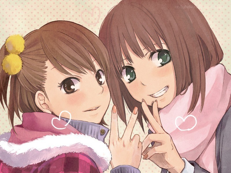 Two girls making peace signs