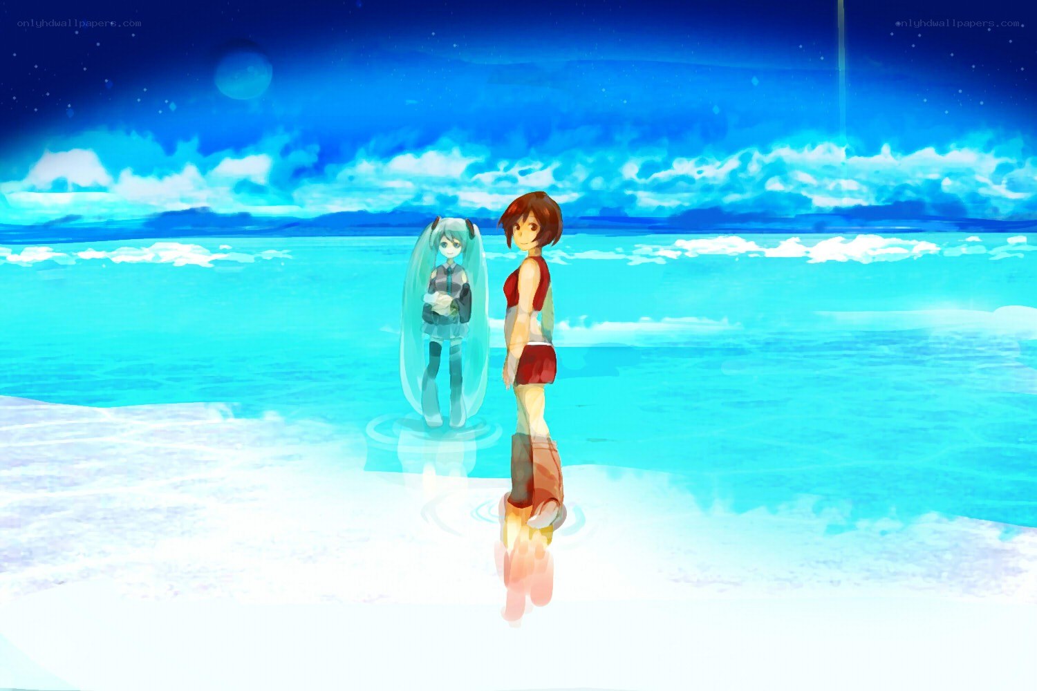 Two girls on a beach at night