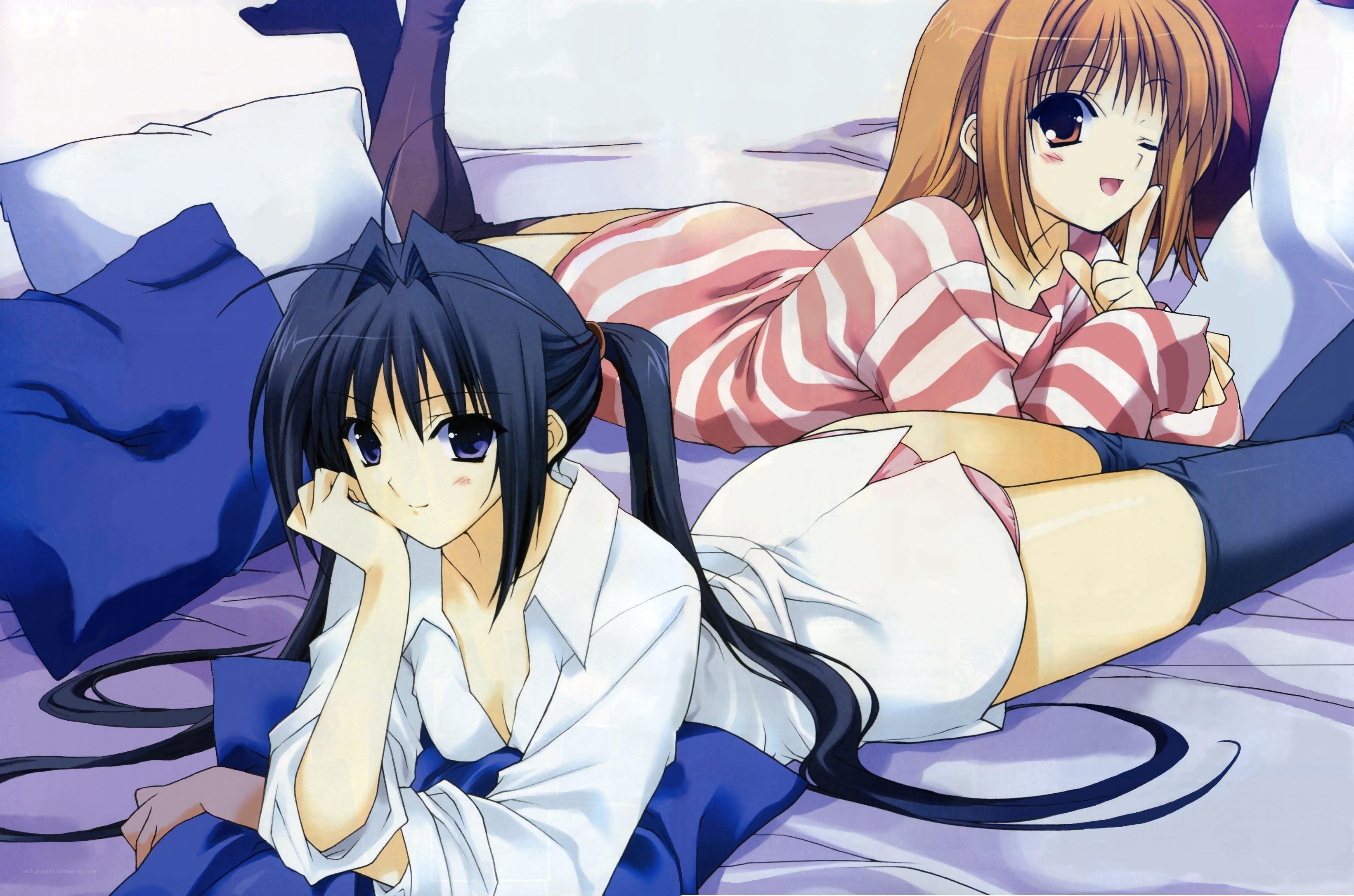 Two girls on a bed