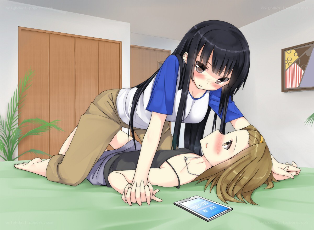 Two girls on a bed