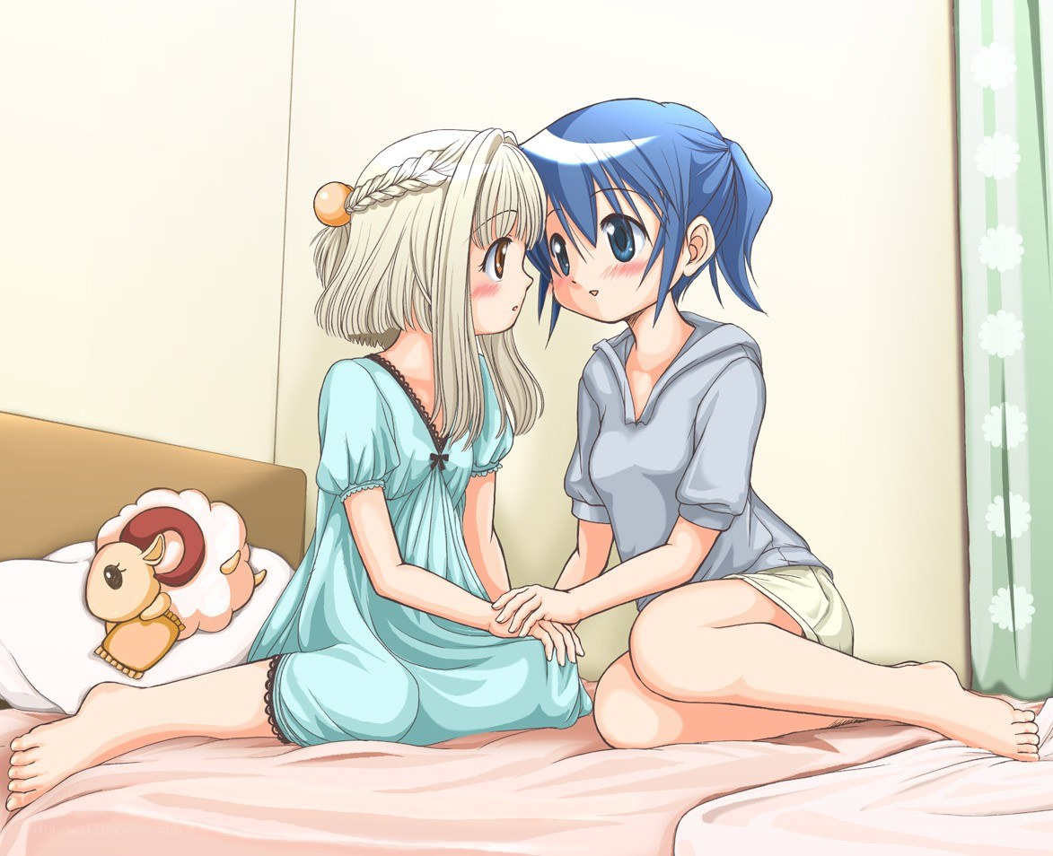 Two girls on a bed