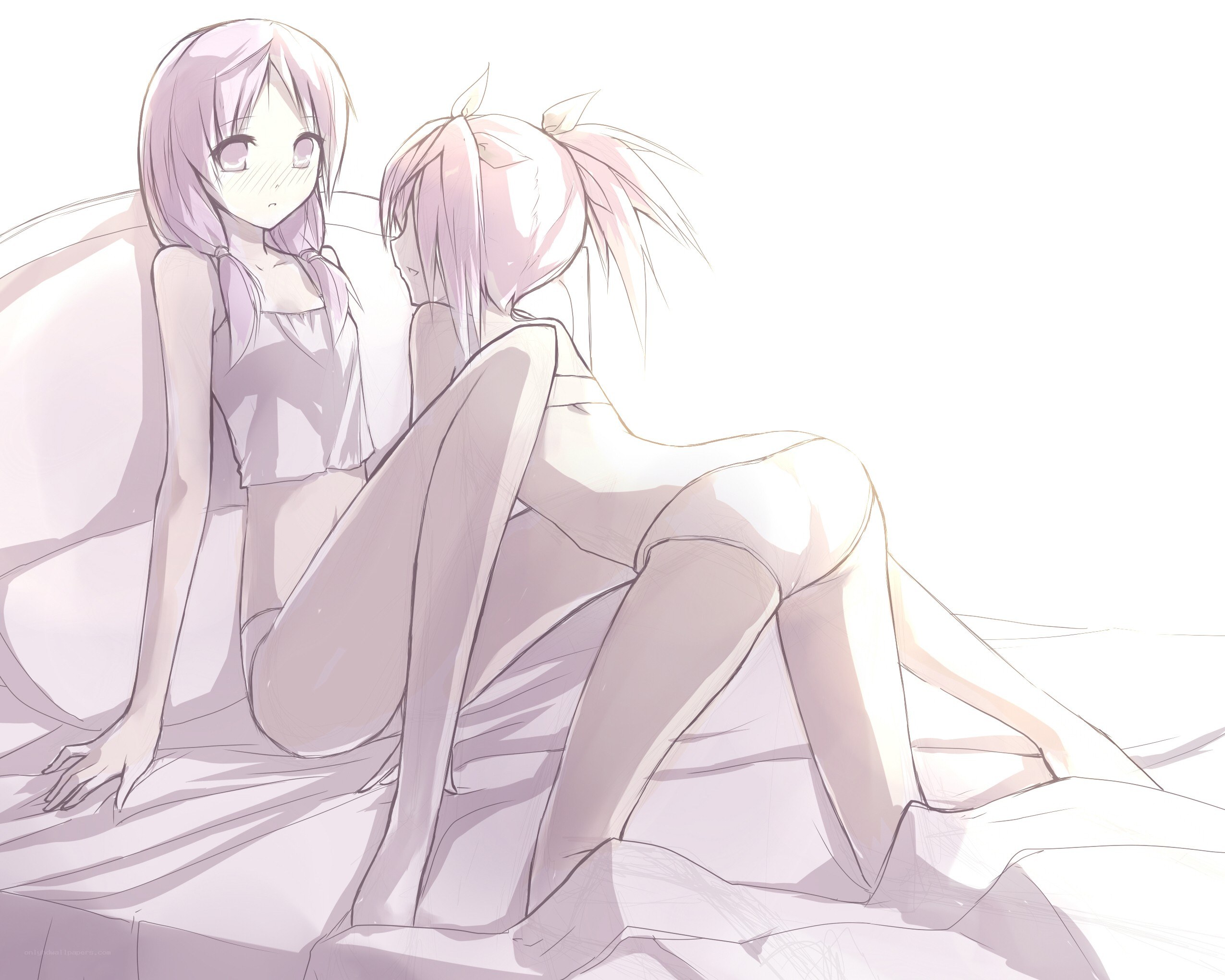 two girls on a bed