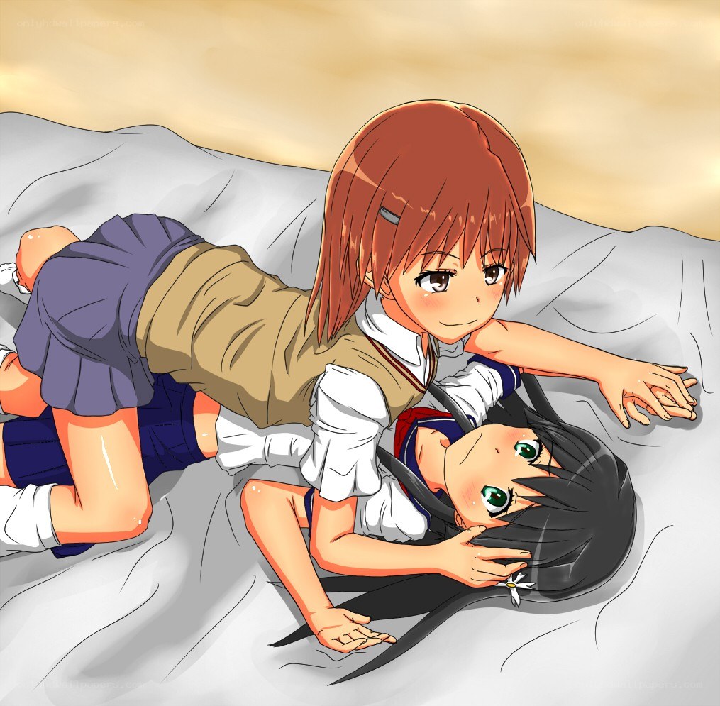 Two girls on a bed