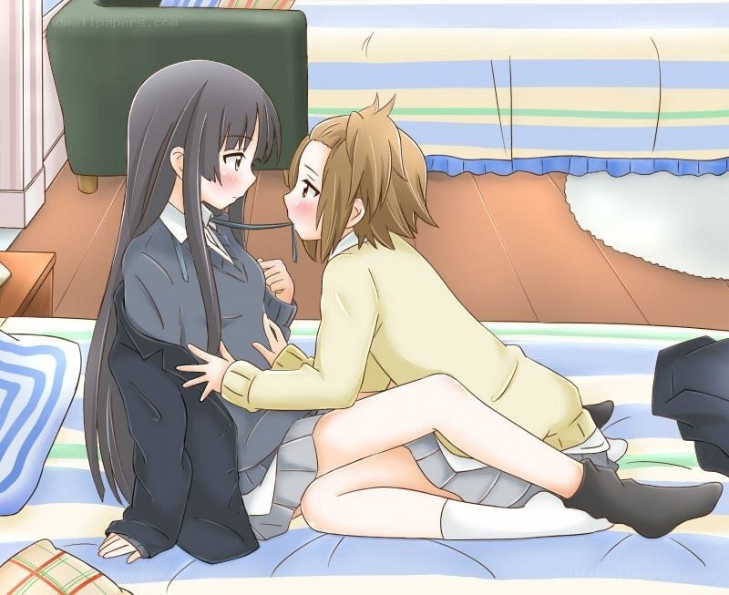 two girls on a bed