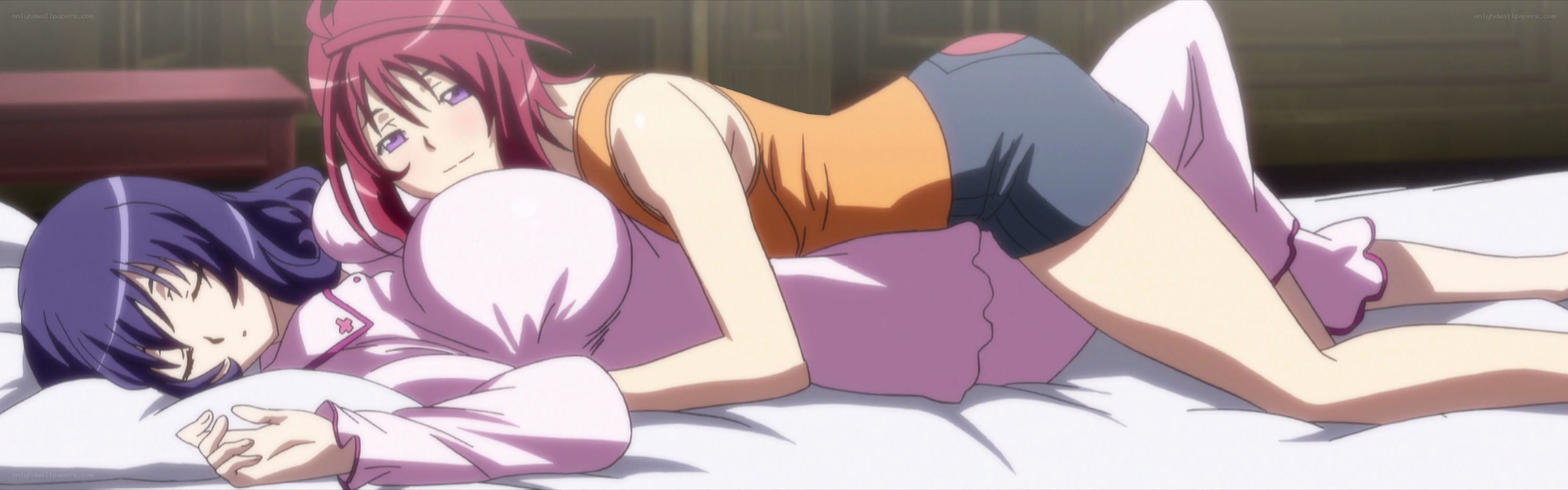 Two girls on a bed