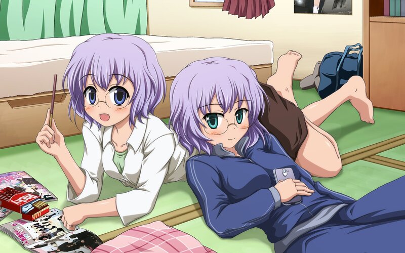 Two girls on a bedroom floor