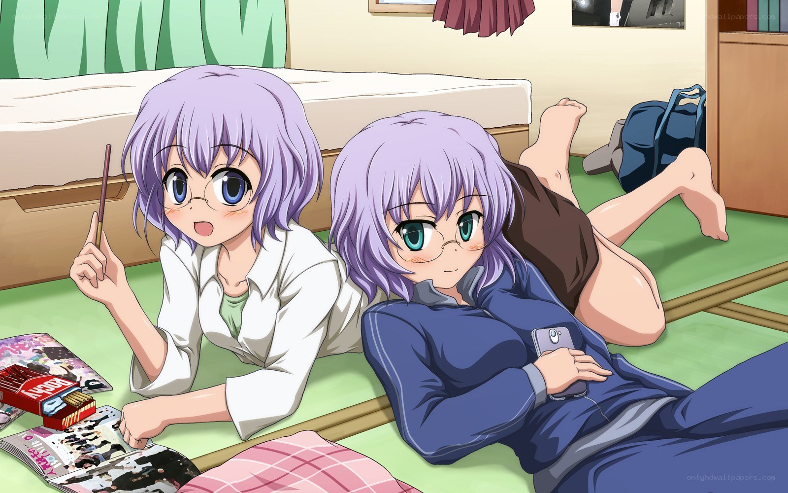 Two girls on a bedroom floor