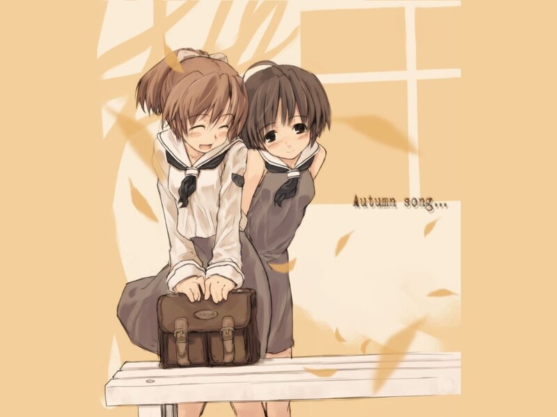 Two girls on a bench in autumn