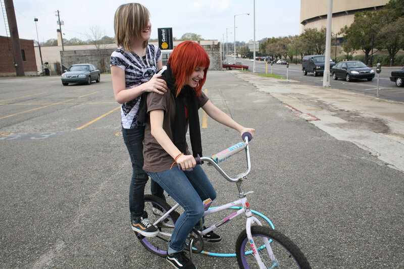 Two girls on a bike together